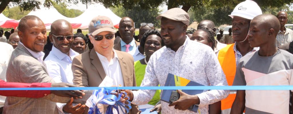 Commissioning of Rehabilitation of School Facilities at Madi Opei Primary School by USAID Mission Director - Mr. Richard L. Nelson and Deputy Resident District Commissioner - Mr. Oguti Sebastian Oswin.